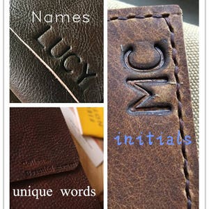 May include: Close-up of a brown leather journal with the name "Lucy" embossed on the cover and the initials "MC" embossed on the spine. The journal has a stitched edge and the text "Collect Beautiful Moments" and "unique words" is embossed on the front cover.