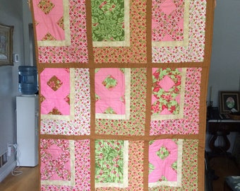 Show how much you care with this pink ribbon quilt