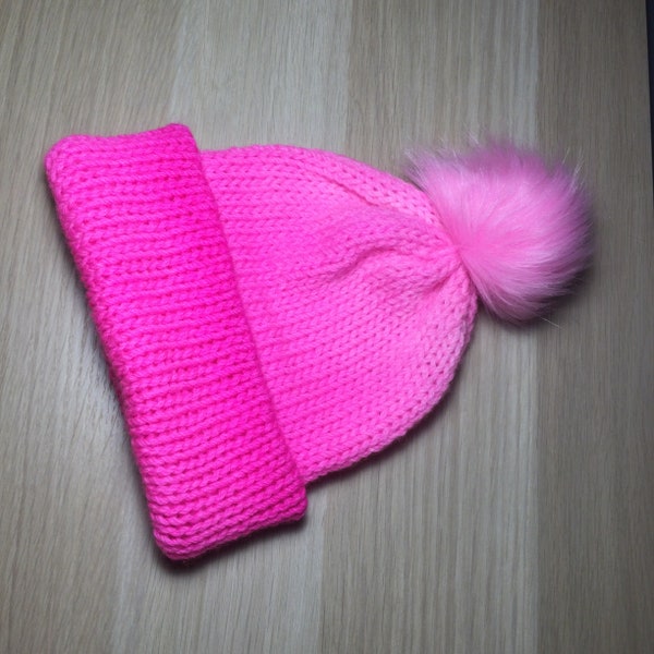 Handmade Beanie, Neon Pink with a fun faux fur pom pom.. 100% Australian superwash wool, This beanie will fit a child or small adult.