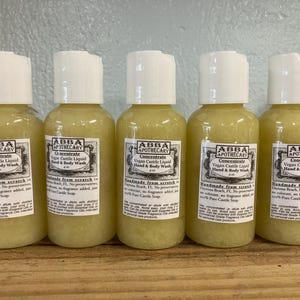 May include: Five 4-ounce bottles of clear, yellow liquid hand and body wash labeled "ABBA APOTHECARY Concentrate Vegan Castile Liquid Hand & Body Wash" with the text "Handmade from scratch Daytona Beach, FL. No preservatives, no colorant, no fragrance added, just 100% Pure Castile Soap."