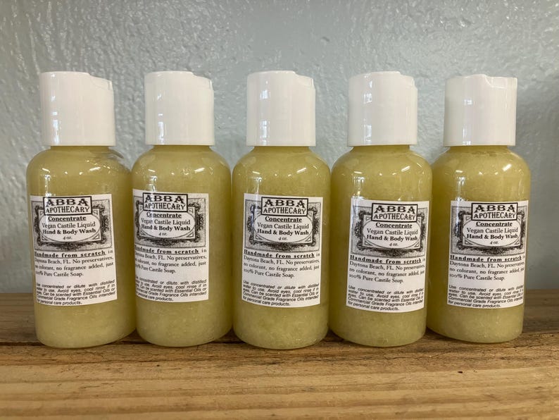 May include: Five 4-ounce bottles of clear, yellow liquid hand and body wash labeled "ABBA APOTHECARY Concentrate Vegan Castile Liquid Hand & Body Wash" with the text "Handmade from scratch Daytona Beach, FL. No preservatives, no colorant, no fragrance added, just 100% Pure Castile Soap."