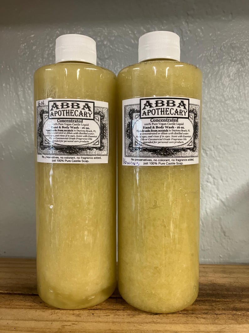 May include: Two clear plastic bottles of concentrated 100% pure vegan castile liquid hand and body wash from ABBA Apothecary. Each bottle is 16 ounces and made from scratch in Daytona Beach, Florida. The bottles are filled with a light yellow liquid.