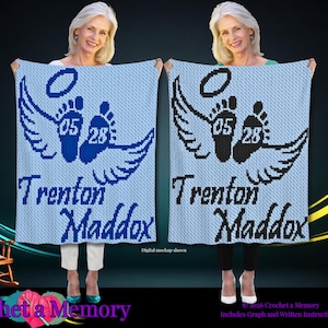 May include: A light blue crochet blanket featuring a dark blue or black graphic of two baby footprints with wings and a halo above them. The numbers 05 and 28 are centered on the footprints, and the name Trenton Maddox is written below in script.