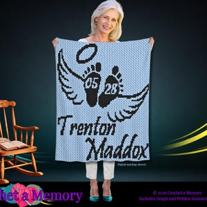 May include: A light blue crochet blanket featuring a black graphic of two baby footprints with wings and a halo above them. The numbers 05 and 28 are centered on the footprints. The name Trenton Maddox is written in black text below the feet.