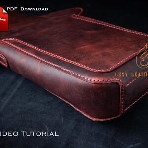 May include: A burgundy leather satchel with pink stitching. The bag has a flap closure and a silver-tone metal clasp. The text "PDF Download" and "No VIDEO TUTORIAL" are visible. The logo "Lexy Leathercraft" is also visible.