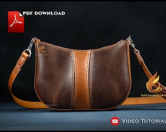 May include: A brown leather shoulder bag with a lighter brown vertical stripe down the center. The bag has a curved shape and a long, adjustable strap. The words "PDF DOWNLOAD" and "VIDEO TUTORIAL" are visible.