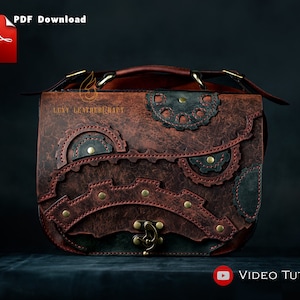May include: A brown leather satchel with a steampunk design featuring gears and rivets. The bag has a top handle and a shoulder strap. The text "LEVY LEATHER CRAFT" is visible on the front of the bag.