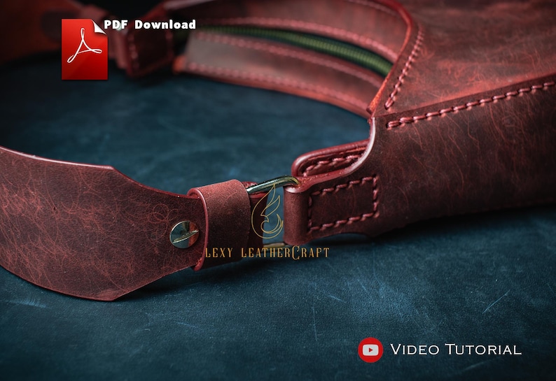 May include: Close-up of a burgundy leather bag with a strap and metal hardware. The bag has visible stitching and a zipper. The image includes the text "PDF Download" and "Video Tutorial". The brand name "Lexy Leathercraft" is also visible.