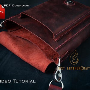 May include: A burgundy leather crossbody bag with a flap closure and a shoulder strap. The bag features visible stitching and metal hardware. The text "PDF Download" and "No VIDEO TUTORIAL" are visible.