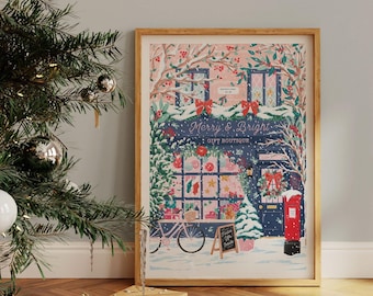 May include: A framed illustration of a storefront with a blue door and a red mailbox. The storefront is decorated with Christmas lights and snow. The sign above the door reads "Merry & Bright Gift Boutique".