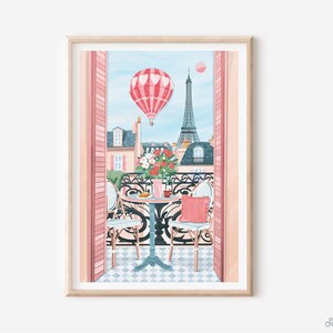 May include: A pink and white hot air balloon floats over a Parisian balcony with a view of the Eiffel Tower. Two chairs and a table with a cup of coffee and pastries are set on the balcony. The balcony is decorated with pink flowers.