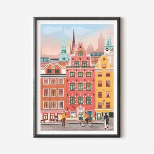 Pode incluir: Uma ilustra&ccedil;&atilde;o colorida de uma cidade com edif&iacute;cios altos de v&aacute;rias cores, incluindo rosa, amarelo e azul. Os edif&iacute;cios t&ecirc;m telhados pontiagudos e janelas. H&aacute; duas pessoas caminhando pela rua, uma com uma bicicleta.