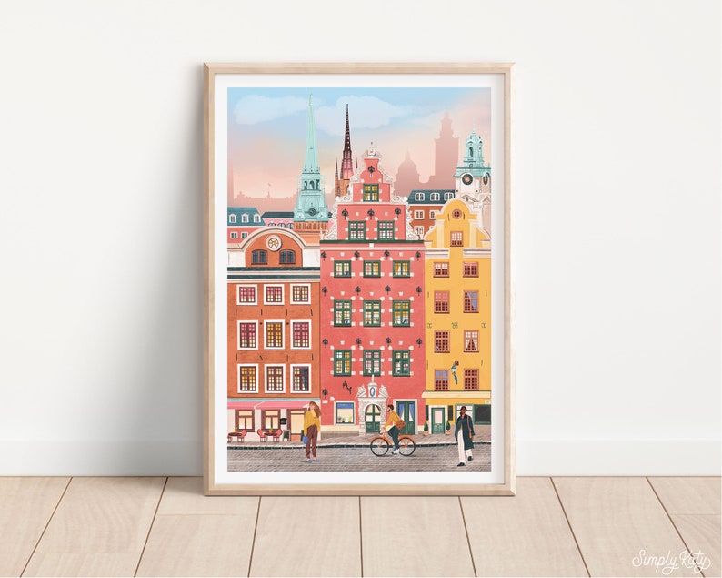 Pode incluir: Uma ilustra&ccedil;&atilde;o colorida de uma cidade com edif&iacute;cios altos, incluindo uma igreja com um campan&aacute;rio, e pessoas caminhando pela rua. Os edif&iacute;cios s&atilde;o pintados em tons de rosa, amarelo e azul.