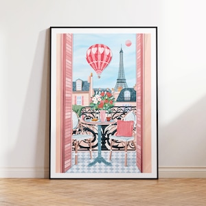 May include: A pink and white hot air balloon floats over a Parisian balcony scene with a view of the Eiffel Tower. Two chairs and a table with a cup of coffee and a pastry are set on the balcony. The balcony is decorated with pink flowers.