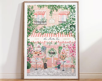 May include: A pink and white storefront with a sign that reads "Cafe de la Belle Vie Amour". The storefront is decorated with flowers and greenery. There are tables and chairs outside the cafe.