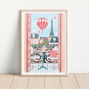 May include: A framed illustration of a Parisian balcony with a table and chairs, a hot air balloon in the shape of a heart, and the Eiffel Tower in the background.