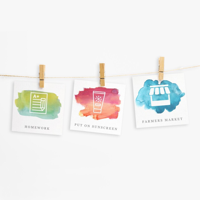 May include: Three watercolor cards with icons and text. The first card is green and has a homework icon with the text "Homework". The second card is red and orange and has a sunscreen icon with the text "Put on Sunscreen". The third card is blue and has a farmers market icon with the text "Farmers Market".
