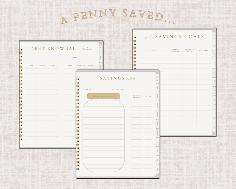 May include: Three spiral-bound notebooks with beige pages and gold accents. The notebooks are labeled "Debt Snowball Tracker", "Yearly Savings Goals", and "Savings Tracker". The text "A Penny Saved..." is at the top.