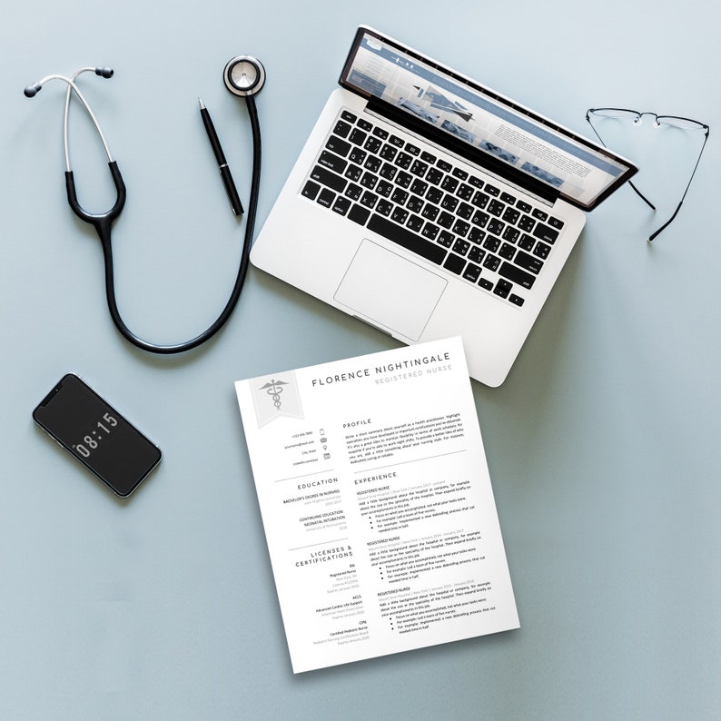May include: A resume for a registered nurse named Florence Nightingale. The resume is printed on white paper and includes sections for profile, education, experience, licenses and certifications. A stethoscope, laptop, glasses, and a smartphone are also visible in the image.