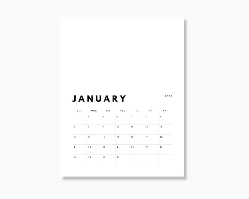 May include: A white wall calendar page for January 2027 with black sans-serif text. The month name is printed in large bold letters at the top, followed by a grid of days of the week and numbered dates from 1 to 31. The design is clean and simple.
