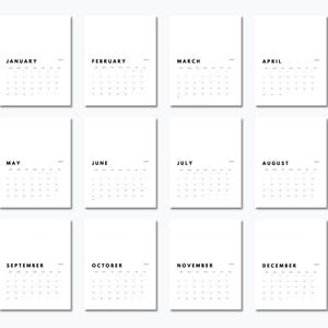 May include: A set of twelve white calendar pages arranged in a grid, each featuring a black month name from January to December, a year label, and a grid of dates. The design is clean and monochromatic with black sans-serif text on white paper.