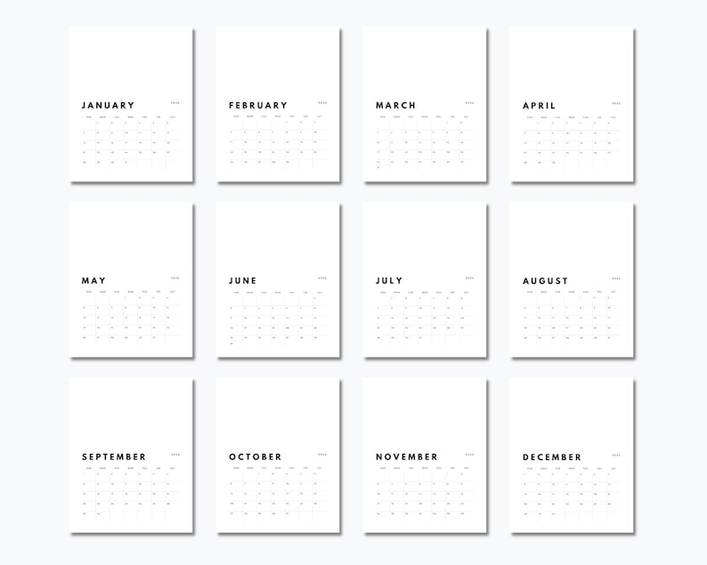 May include: A set of twelve white calendar pages arranged in a grid, each featuring a black month name from January to December, a year label, and a grid of dates. The design is clean and monochromatic with black sans-serif text on white paper.