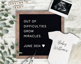 May include: A black letter board with the text "Out of difficulties grow miracles" and "June 2024" with a heart emoji. A white onesie with the text "Baby Williams" is on a white surface. A small ultrasound image is in the top right corner.