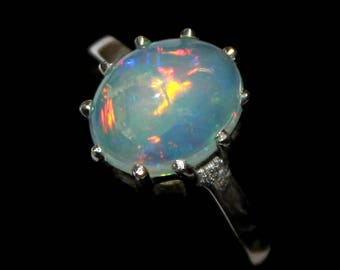 50% Off A Magical 9 x 11 MM Natural Ethiopian Opal Ring with a stunning set in sterling silver Size is ( US 7 ) 0051