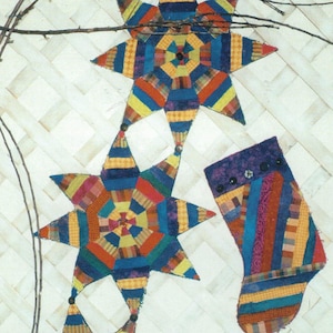 May include: A craft pattern titled "Celebrations Table Runner & Stocking" featuring star-shaped ornaments and a stocking. The ornaments and stocking are made of colorful fabric strips. The pattern is from "I Wanna Quilt!" Pattern Company.