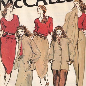 May include: A set of three ceramic canisters with lids, featuring a geometric pattern in shades of blue, white, and gray. The canisters vary in size, suitable for kitchen storage.