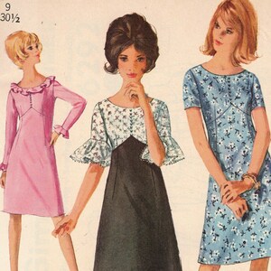 May include: A vintage Simplicity sewing pattern for a junior size 9 dress. The pattern shows three different styles of dresses, one pink, one black and white, and one blue and white. The pattern number is 6292 and the price is 65 cents.
