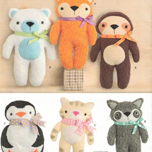 May include: A Simplicity sewing pattern for making plush toys. The pattern includes instructions for making a fox, a sloth, a bear, a penguin, a cat, and a raccoon. The pattern is for one size and is designed and printed in the USA.