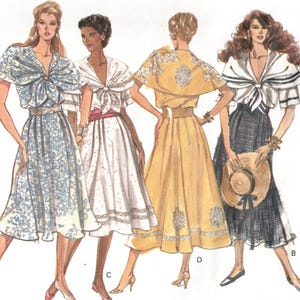 May include: A Vogue's Basic Design sewing pattern envelope 2314 labeled Very Easy. The illustration displays five variations of a dress featuring a tie-front bodice, a flared skirt, and a cape-style overlay in white, blue, yellow, and black patterns.