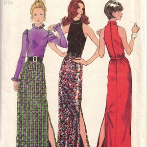 May include: Simplicity sewing pattern 5240 featuring three long dresses. The pattern includes a purple top and green skirt, a black top and floral skirt, and a red dress. Size 12, bust 34 inches, waist 26.5 inches.