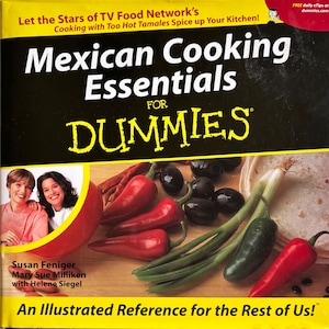 May include: A cookbook titled "Mexican Cooking Essentials for Dummies" with a yellow and black cover. The cover features images of red chili peppers, black olives, green onions, and tortillas. The authors are Susan Feniger, Mary Sue Milliken, and Helene Siegel.
