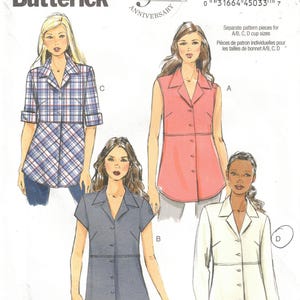 May include: Butterick B5924 sewing pattern featuring four shirt designs. The pattern includes a sleeveless pink shirt, a short-sleeved gray shirt, a long-sleeved white shirt, and a plaid shirt with rolled-up sleeves. The pattern is for sizes 10-18.
