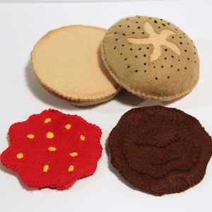 Poppy seed roll with strawberry jam and chocolate cream hand-sewn from felt for the play kids kitchen, play kitchen