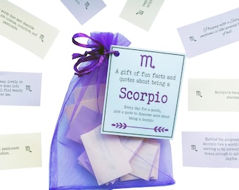 May include: A purple organza bag filled with small white cards. The bag has a tag attached that says "A gift of fun facts and quotes about being a Scorpio. Every day for a month, pick a quote to discover more about being a Scorpio."