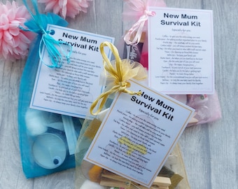 May include: Three gift bags filled with various items, each with a tag that reads "New Mum Survival Kit" and a list of items included in the kit. The bags are made of blue, pink, and gold mesh.