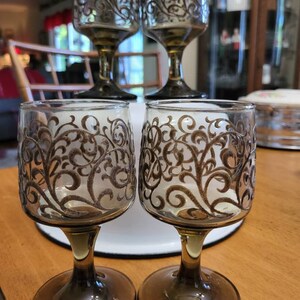 Four Vintage Swirled Design Stemmed/ Pedestal Glasses