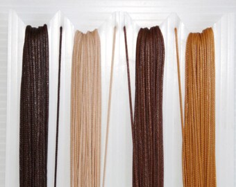 Earth-tone colours of Tiger Thread, 20 yards each of mid-brown, beige, cigar and colonial tan, AKA Ritza 25