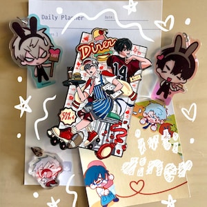 May include: A collection of anime-style character charms and pins. The main pin features a diner scene with a waiter on roller skates. Other charms depict characters with bunny ears and cafe-related items. The color palette includes red, blue, and white.