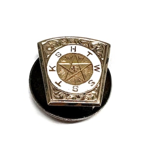 May include: A set of three ceramic mugs with a speckled, cream-colored glaze. Each mug features a different hand-painted design: a blue and green leaf, a yellow flower, and a red berry. The mugs have a simple, rounded shape.