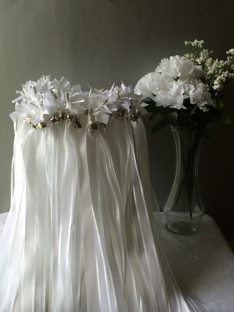 75 White Wedding Wands with silver bells.