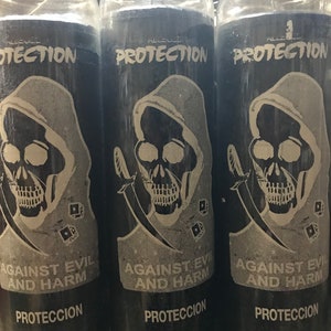 May include: Three black glass candle jars with white labels. Each jar has a skull graphic with a sword and dice. The labels read "Protection Against Evil and Harm" and "Proteccion".