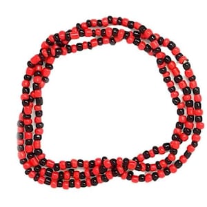 May include: A red and black beaded necklace with multiple strands. The beads are small and round.