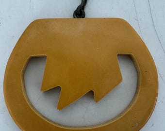 Vintage Bakelite Pendant Carved Cutout Butterscotch  2” X 1.75”