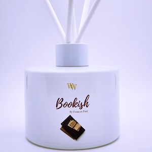 May include: White diffuser bottle with a label that says "Bookish by Frances Paul" and a small image of stacked books. The label also has the letters "WW" in gold.