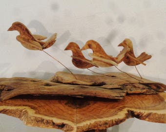 Doves of peace ,olive wood sculpture, birds in flight , shivering on copper wire struts