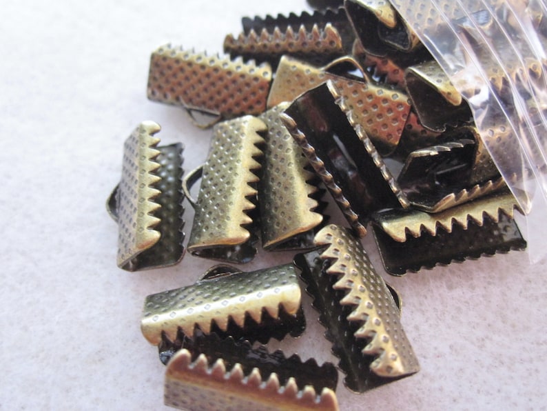50-16mm Silver and Bronze Ribbon Crimp Ends with Loop.
